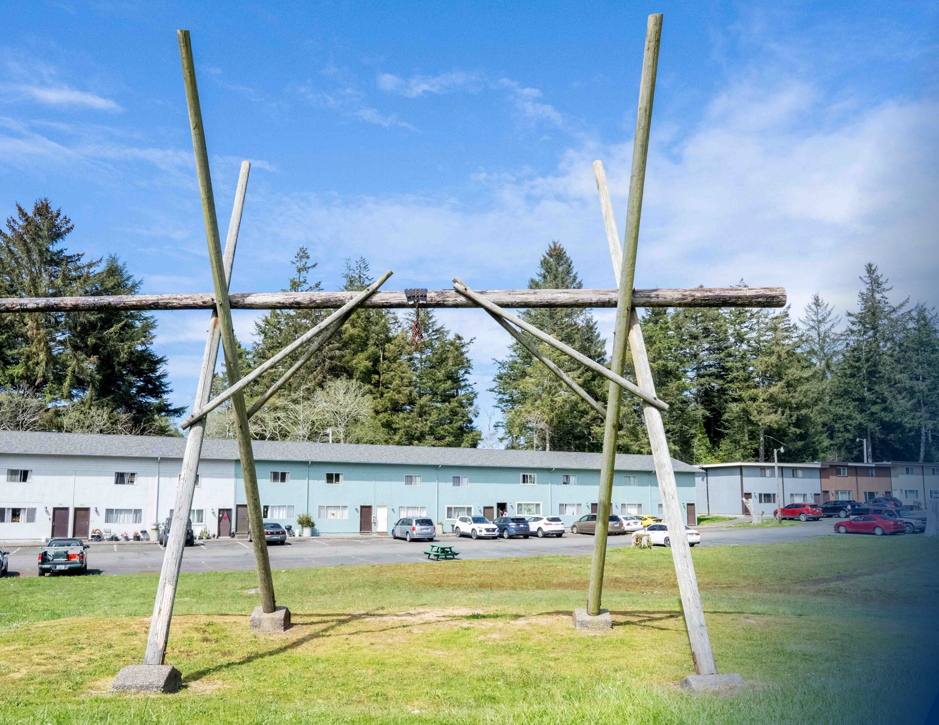 Totem-style wooden structure on the central lawn